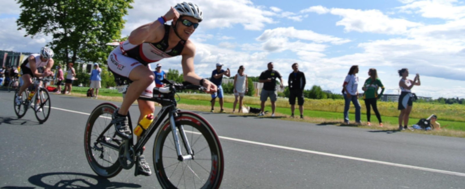 Bicyclists leaning into turn